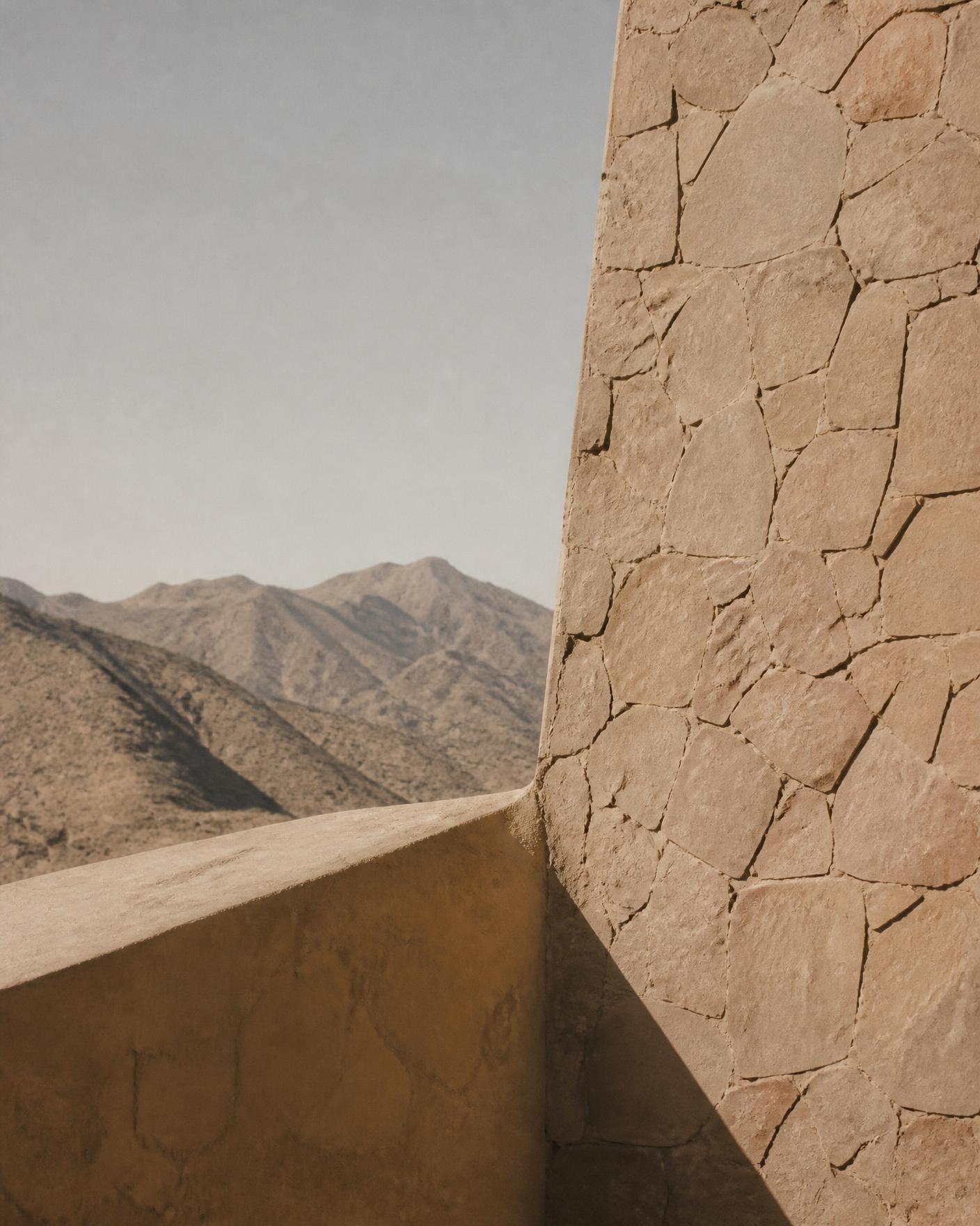 Stone wall and Atlas mountains in Morocco